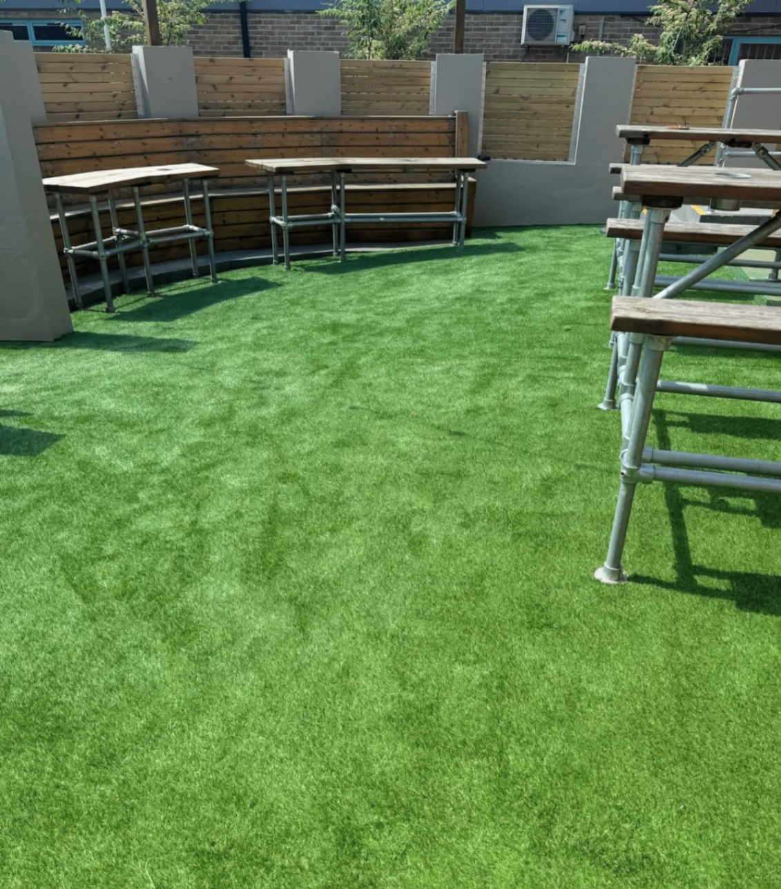 Artificial grass installed in an outdoor seating area